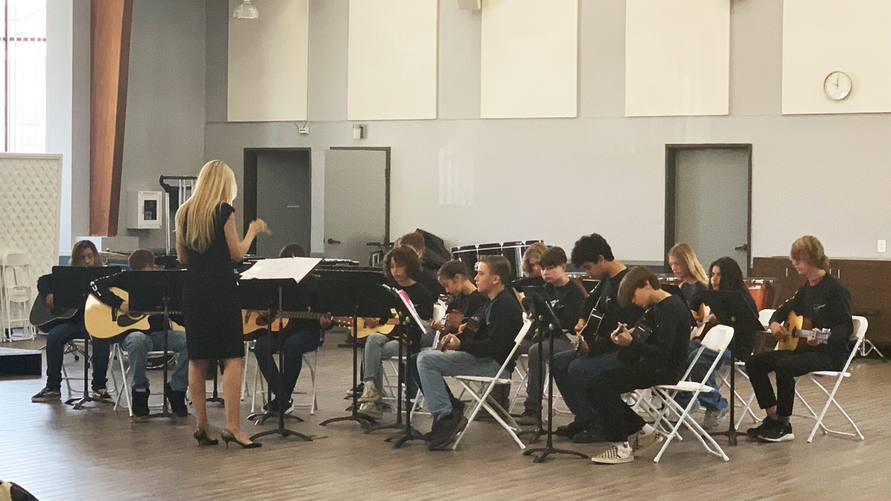 Stacy conducting her guitar ensemble